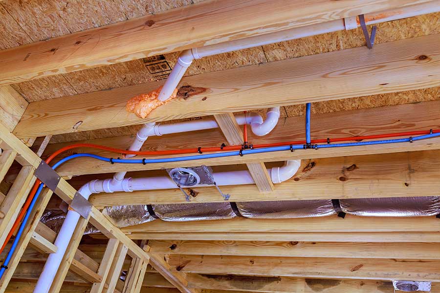 Home repiping in Lake Oswego showing exposed ceiling pipes